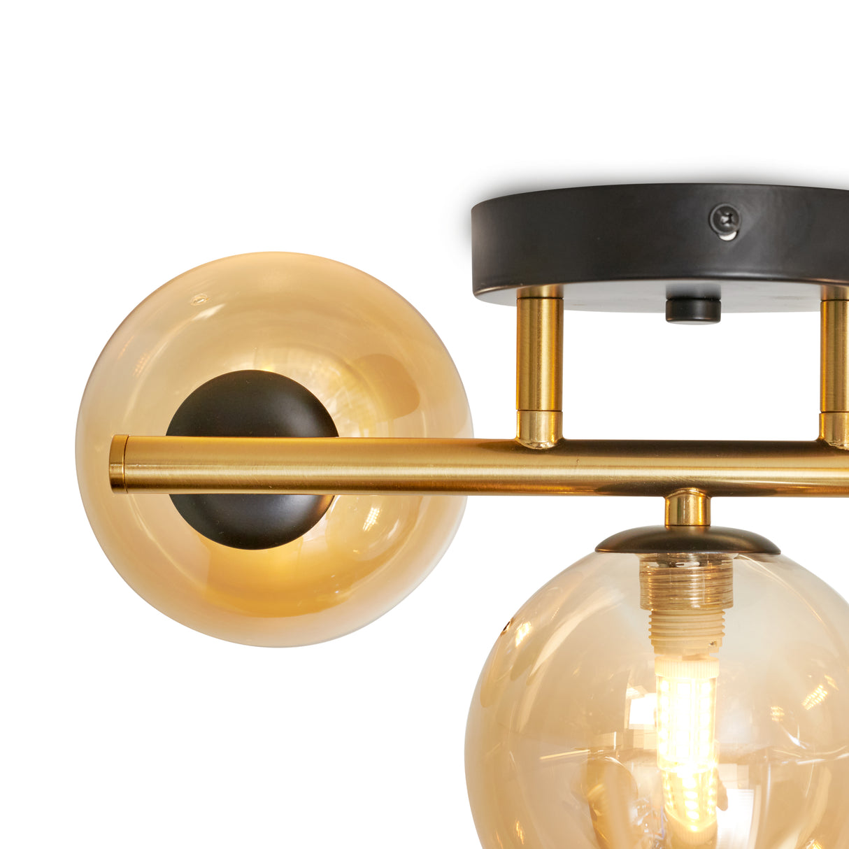 Guld loftslampe med 3 ravgule glaskugler