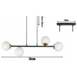 Witte bol hanglamp zwart goud met 4 lampen boven eettafel