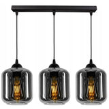 Industriële hanglamp zwart rookglas boven eettafel