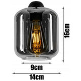 Industriële hanglamp zwart rookglas boven eettafel