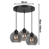 3-lichts hanglamp smoke glas boven eettafel industrieel